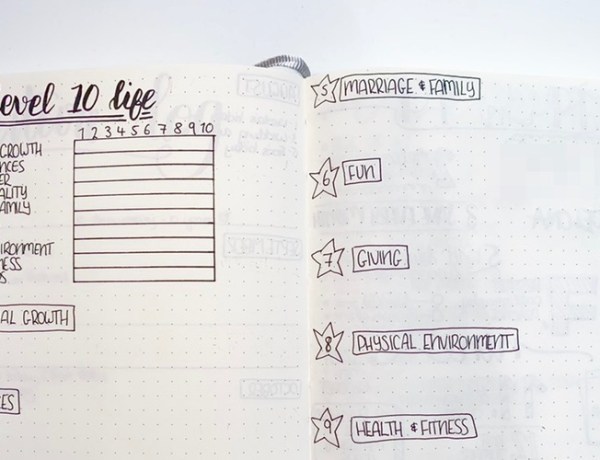 Open bullet journal showing Level 10 Life Exercise